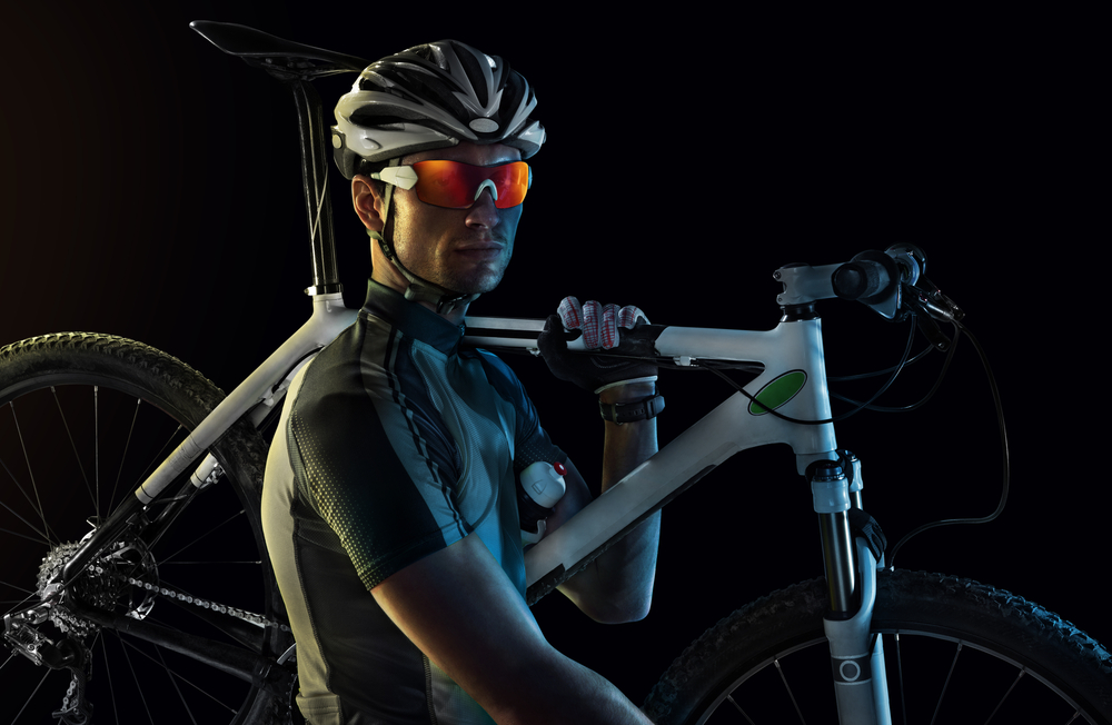 Sport.,Cyclist,Carry,A,Bike,On,Dramatic,Sky.